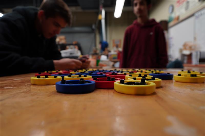 Students look onwards at the switches they are making.