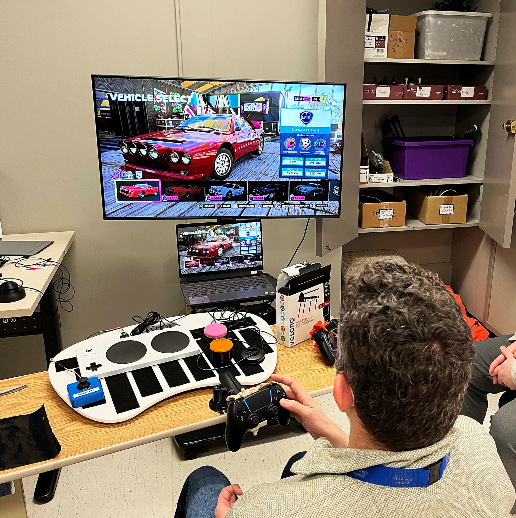 A man using a one handed PS5 controller to game