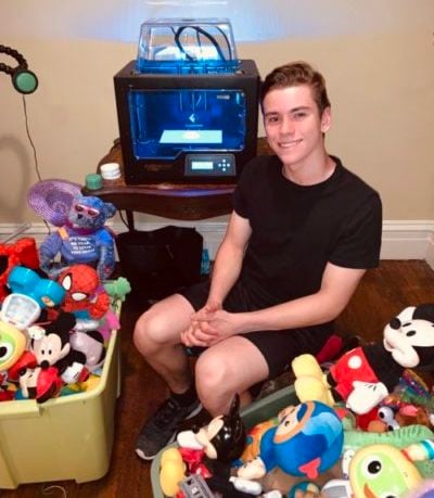 Michael, an MMC volunteer pictured with toys.