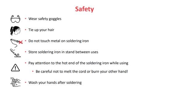A slide showing solder safety tips including wear goggles, pay attention to the hot end.