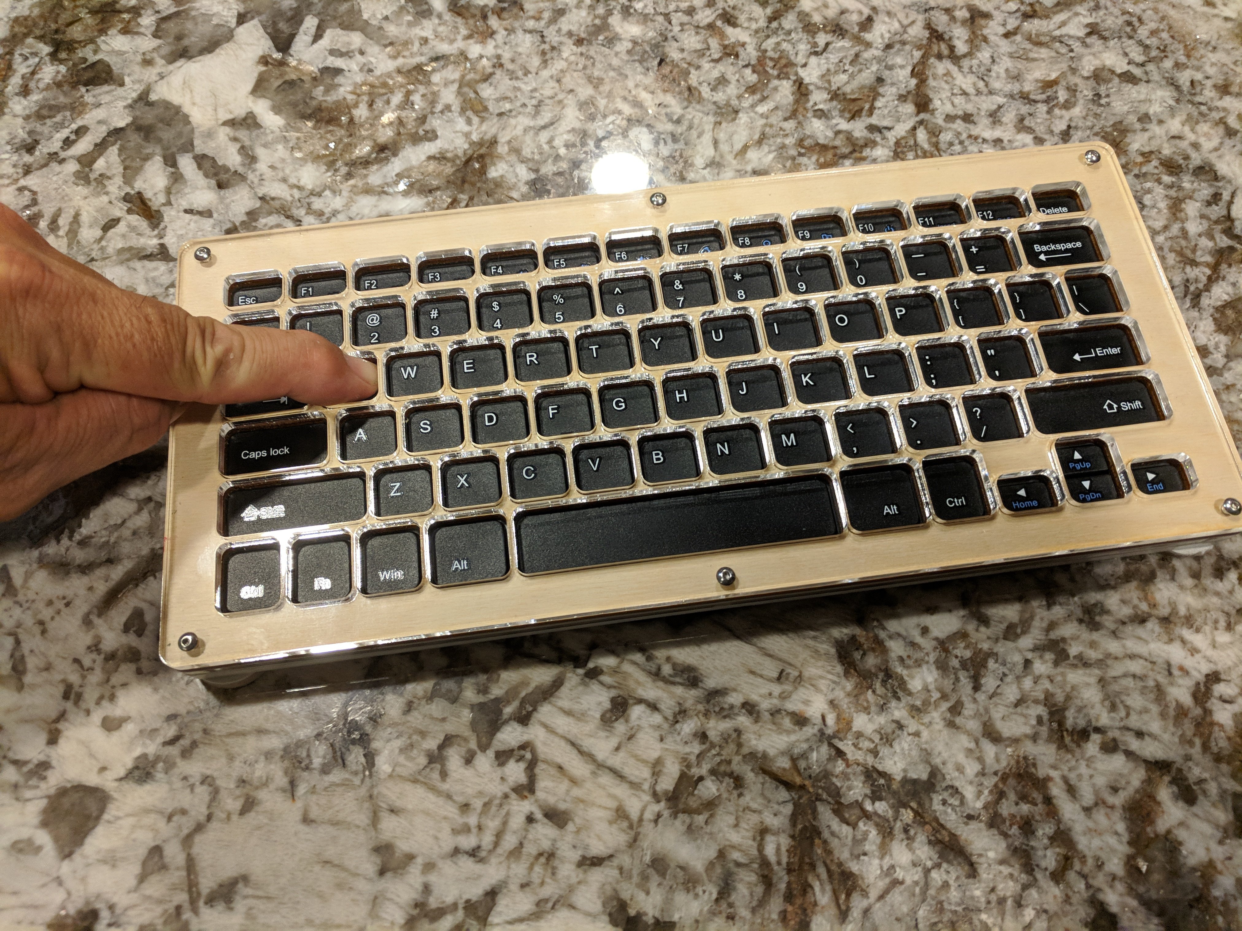 Keyguard for Teknet Wireless keyboard lasercut from wood placed over the keyboard