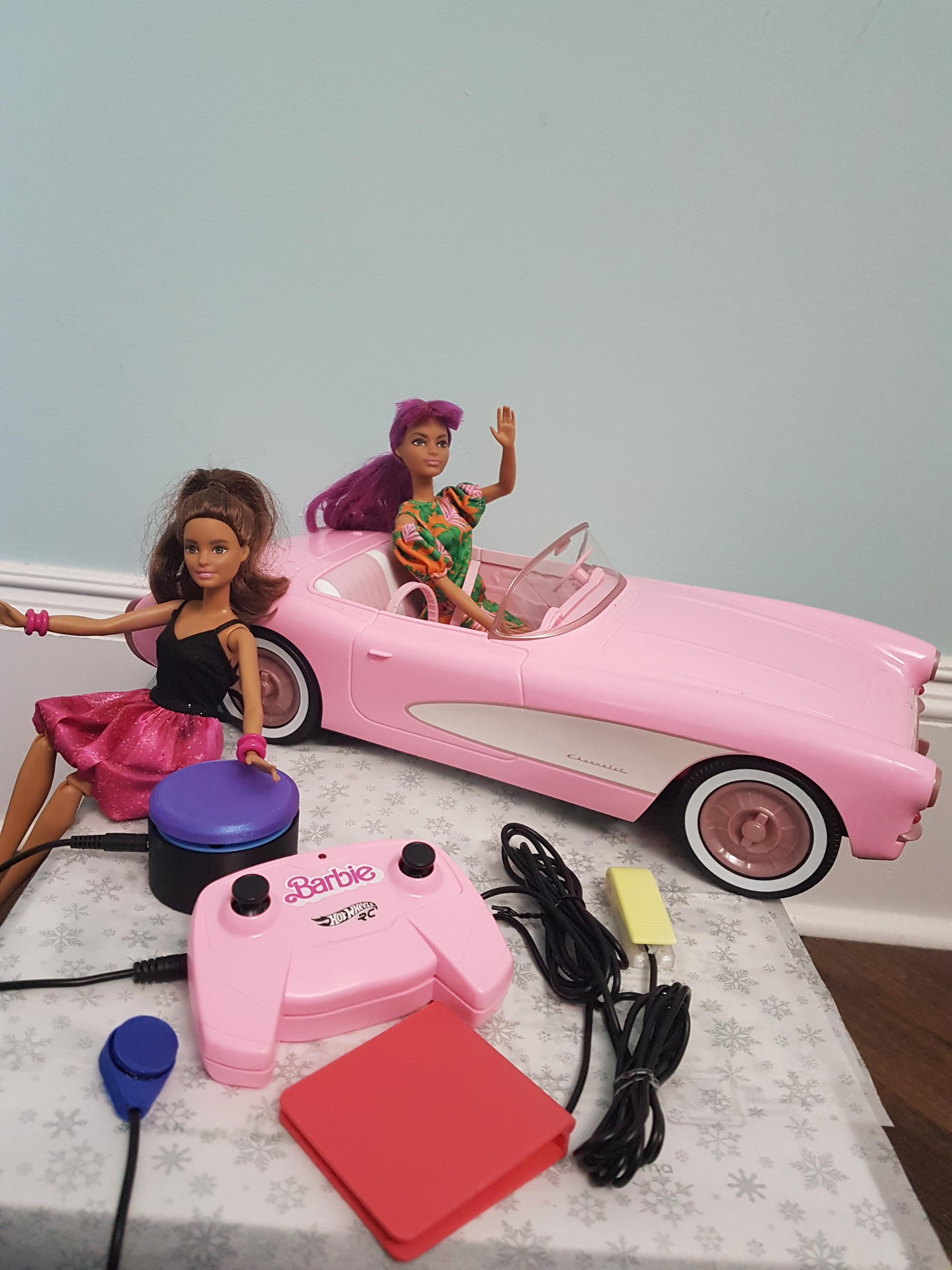 switch adapted barbie car with a 3d printed switch plugged in