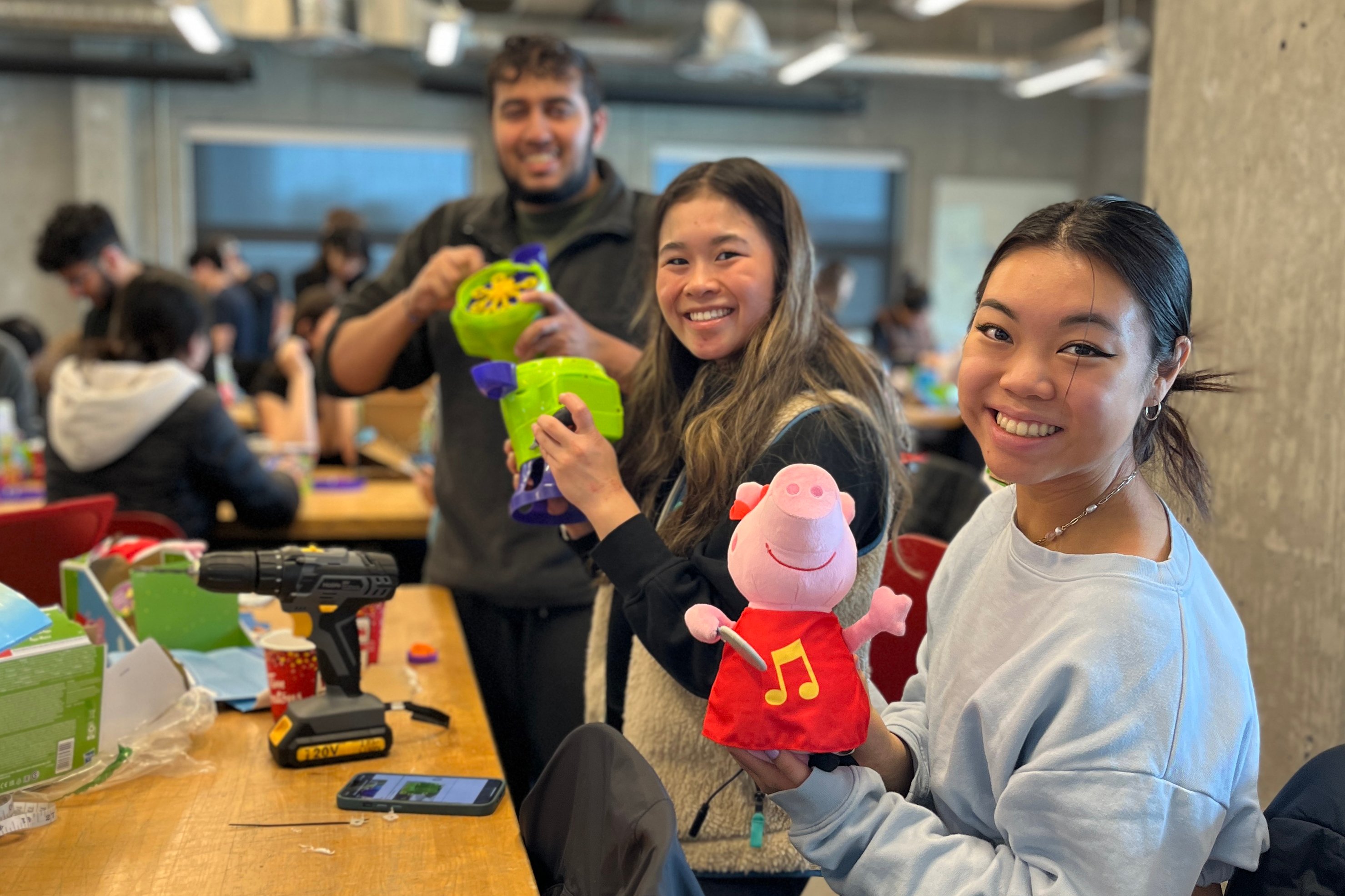 University students show off their adapted toys at a previous Clubs That Care event.