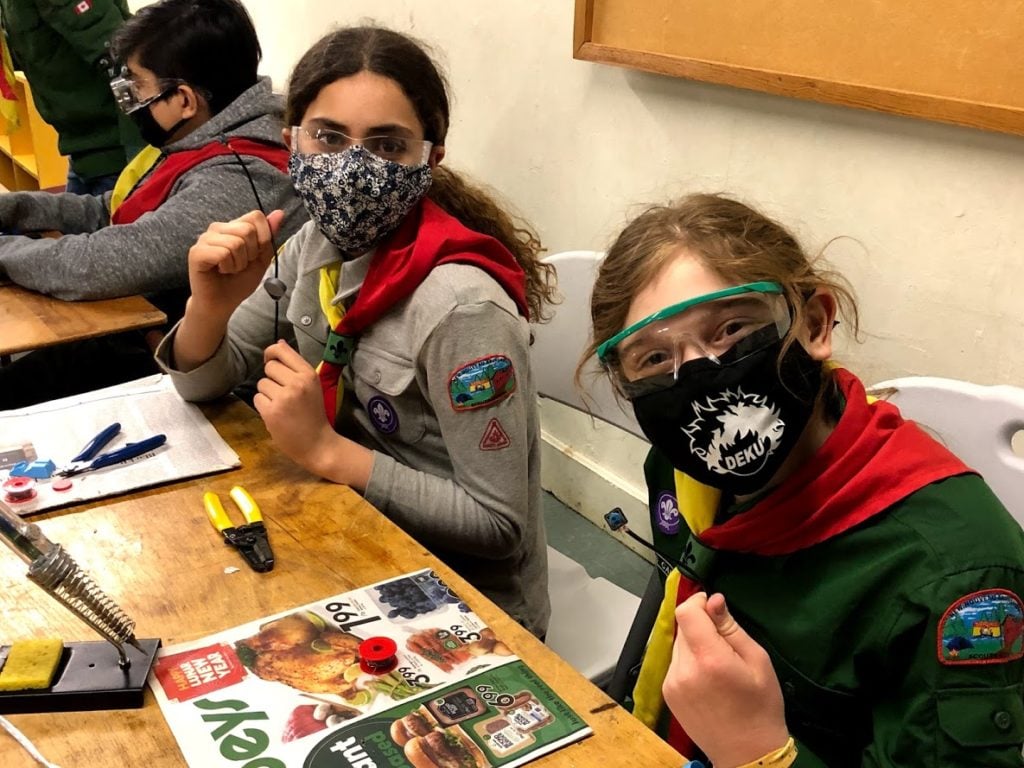 Scout volunteers pictured holding their electronic parts.