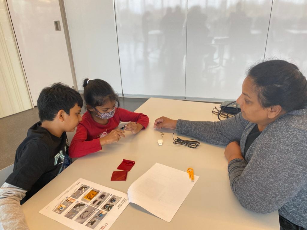 Participants making assistive devices.