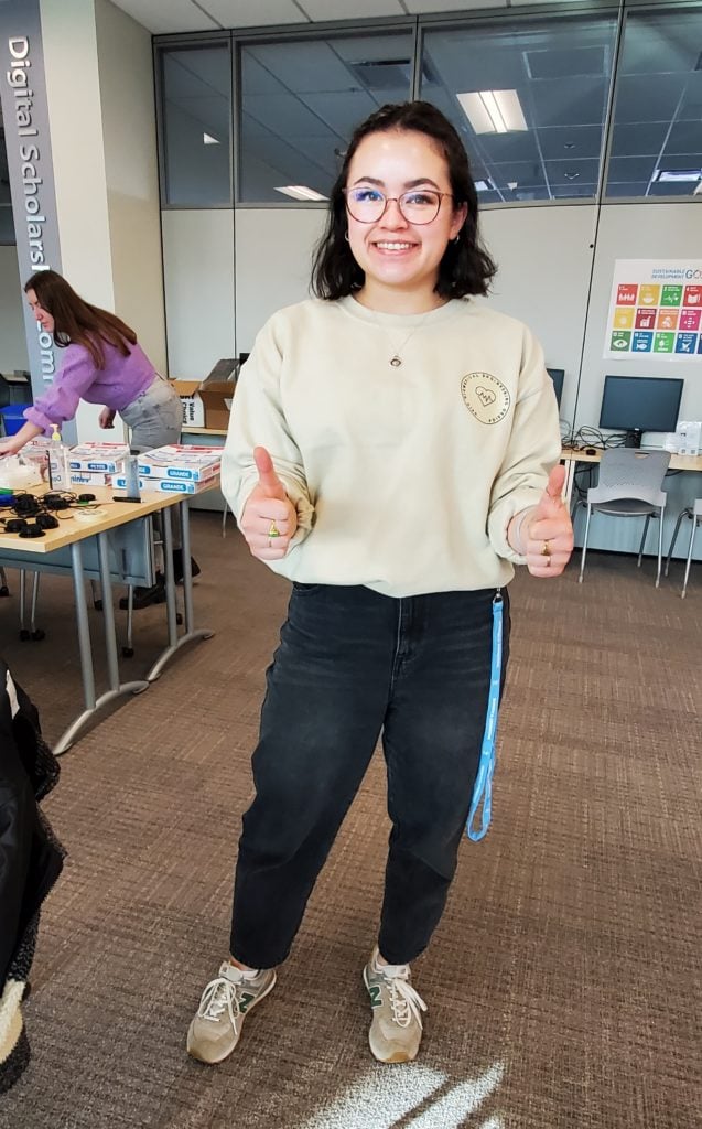 Adriel, president of UVIC BMED, doing a thumbs up.