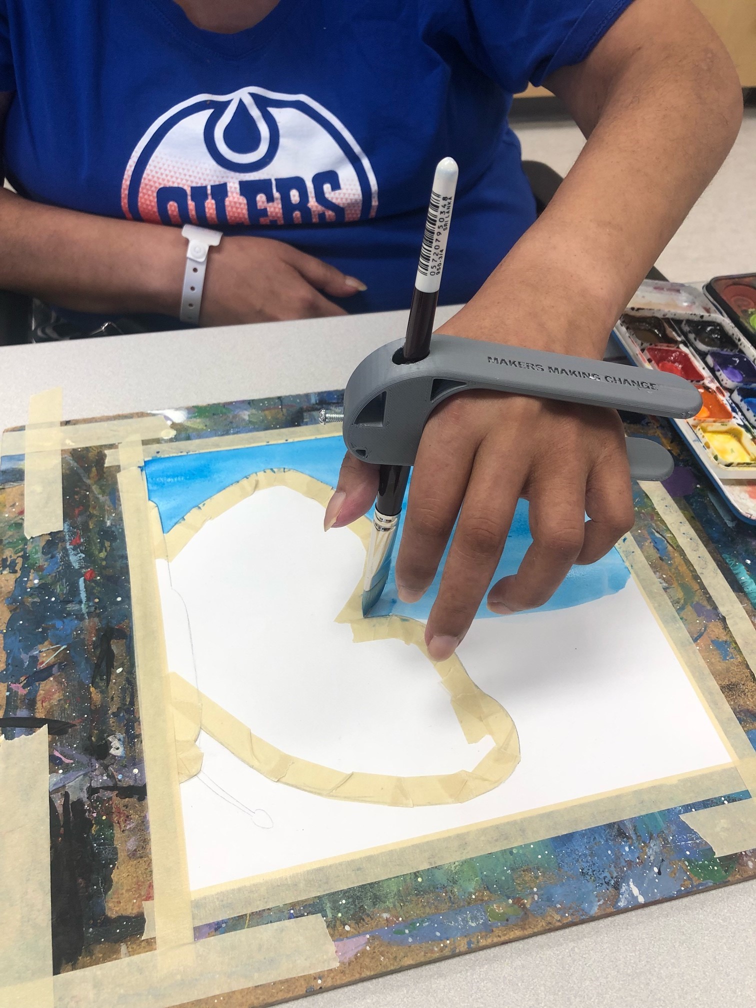 An Oiler's fan using a grey 3d printed palm pen holder to paint