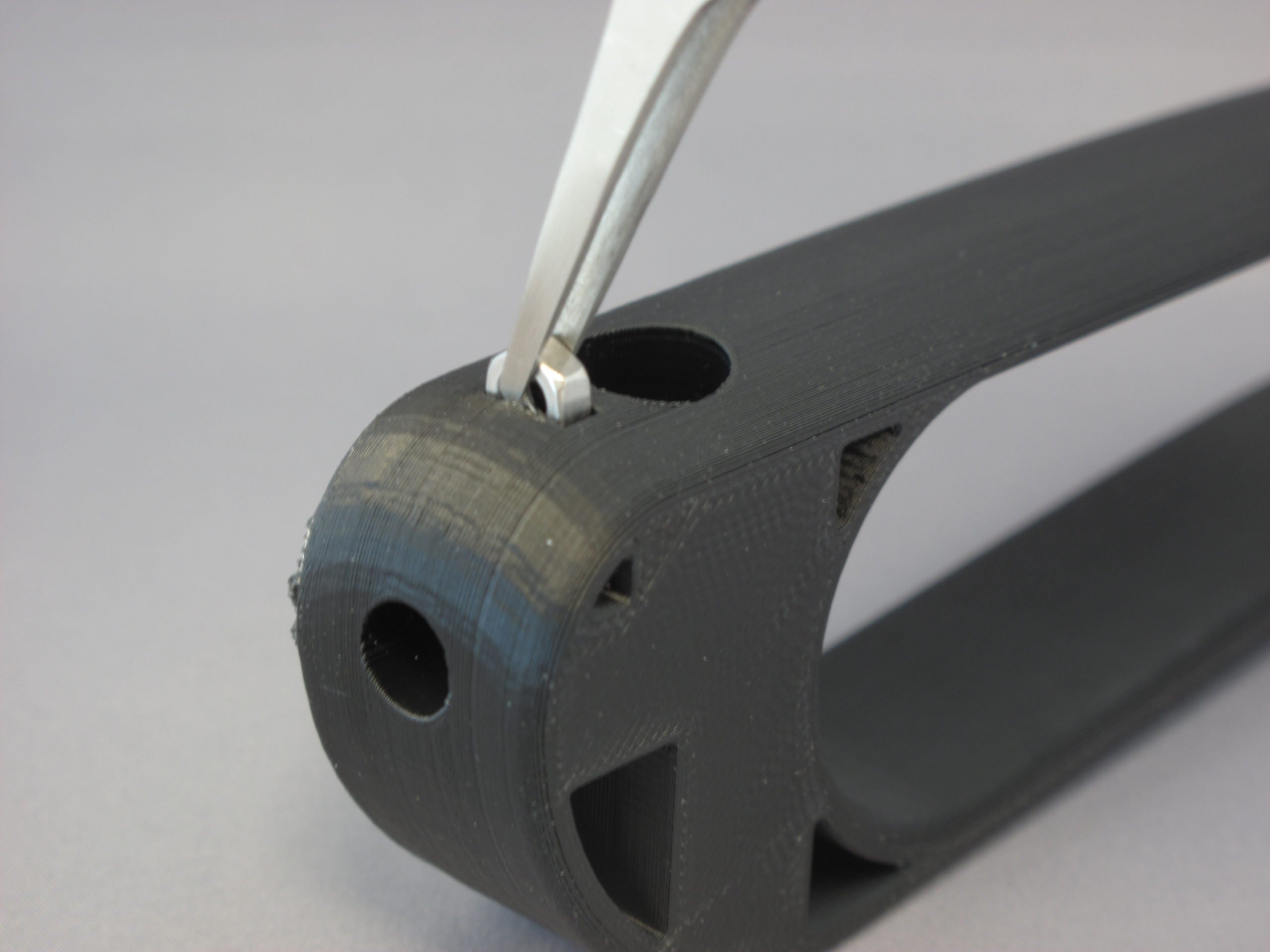 A user using the 3D Printed Palm Pen Holder to draw on a piece of paper with ease