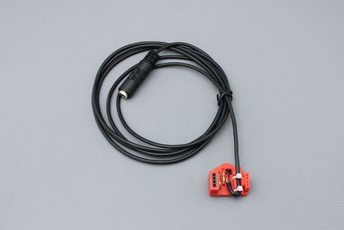 A LipSync Switch Input Module with stereo cable