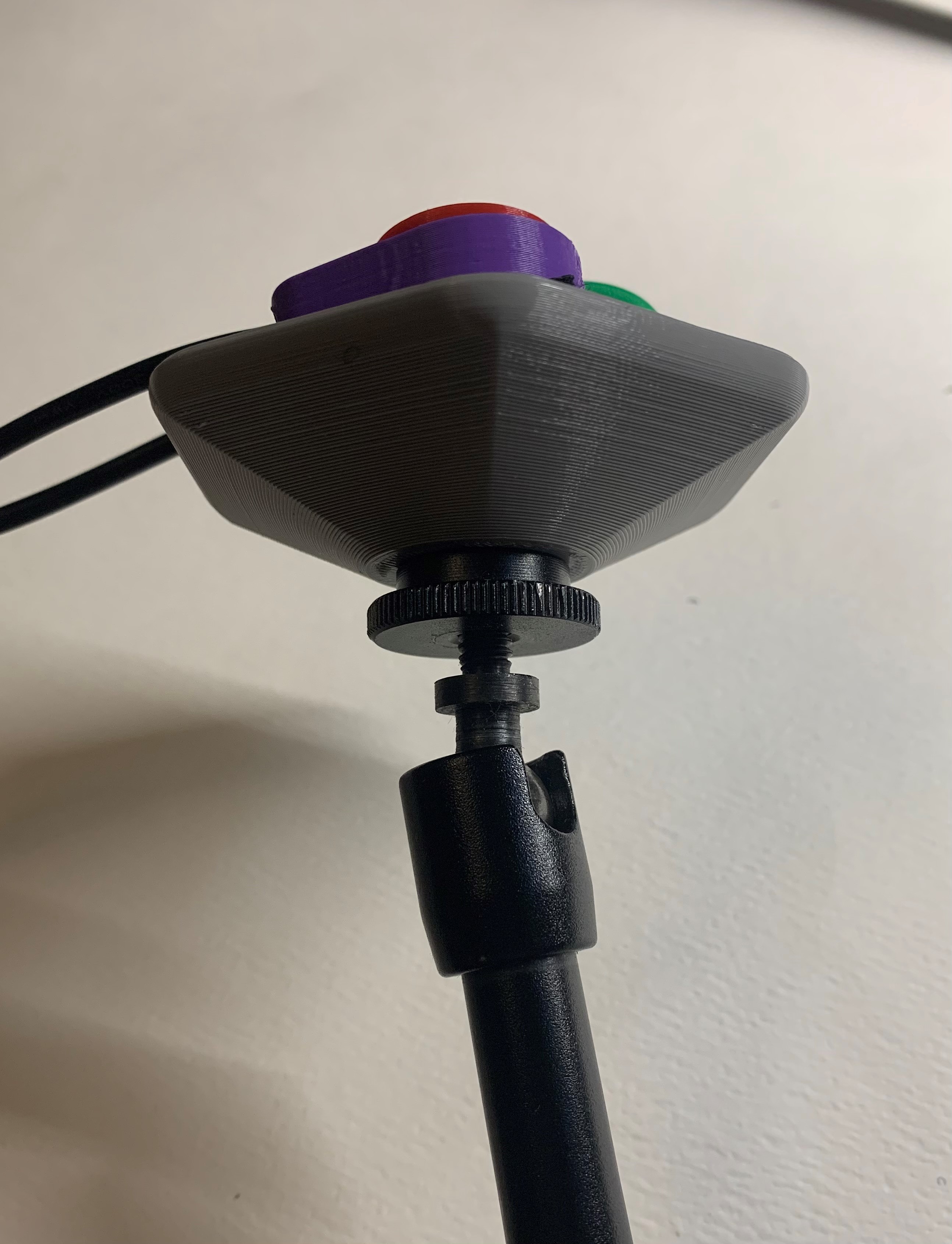 Side view of Open Universal Mount showing the fully tight threaded connection to a mounting arm