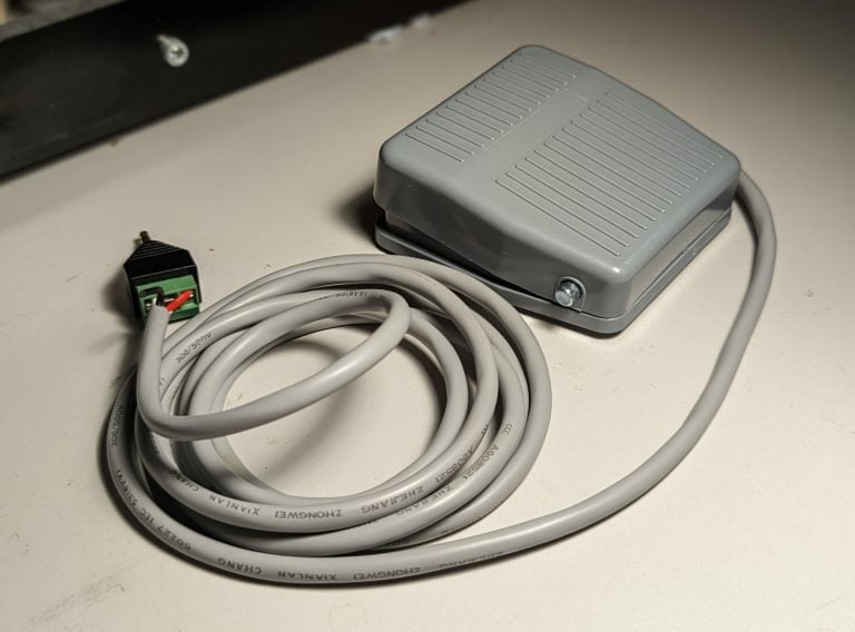 A grey foot pedal switch.