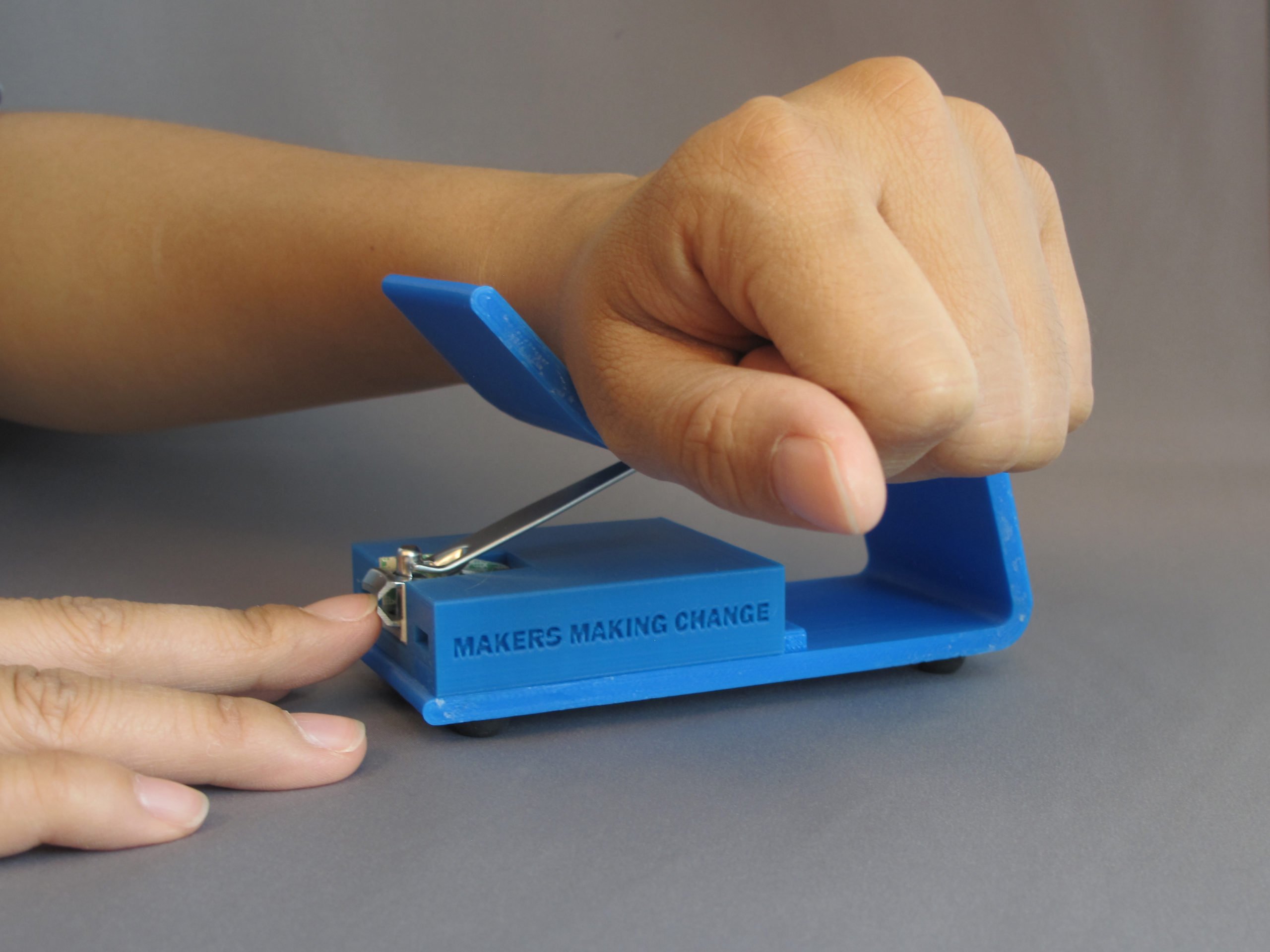 A user using the 3D Printed Nail Clipper to clip their nails with ease