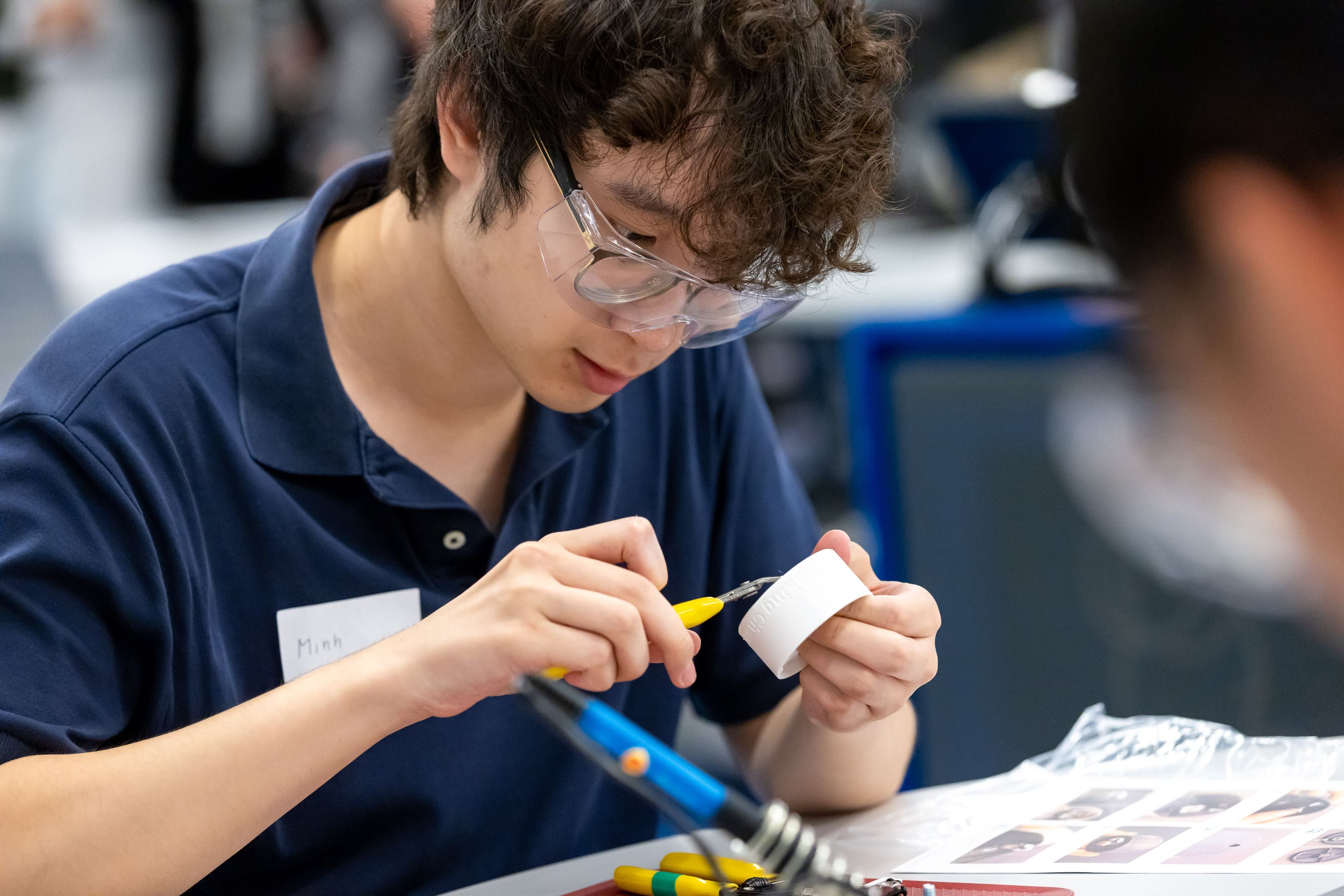 An individual holdings tools building an adaptive device.