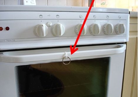 Key ring attached to an over door with a nylon tie strap