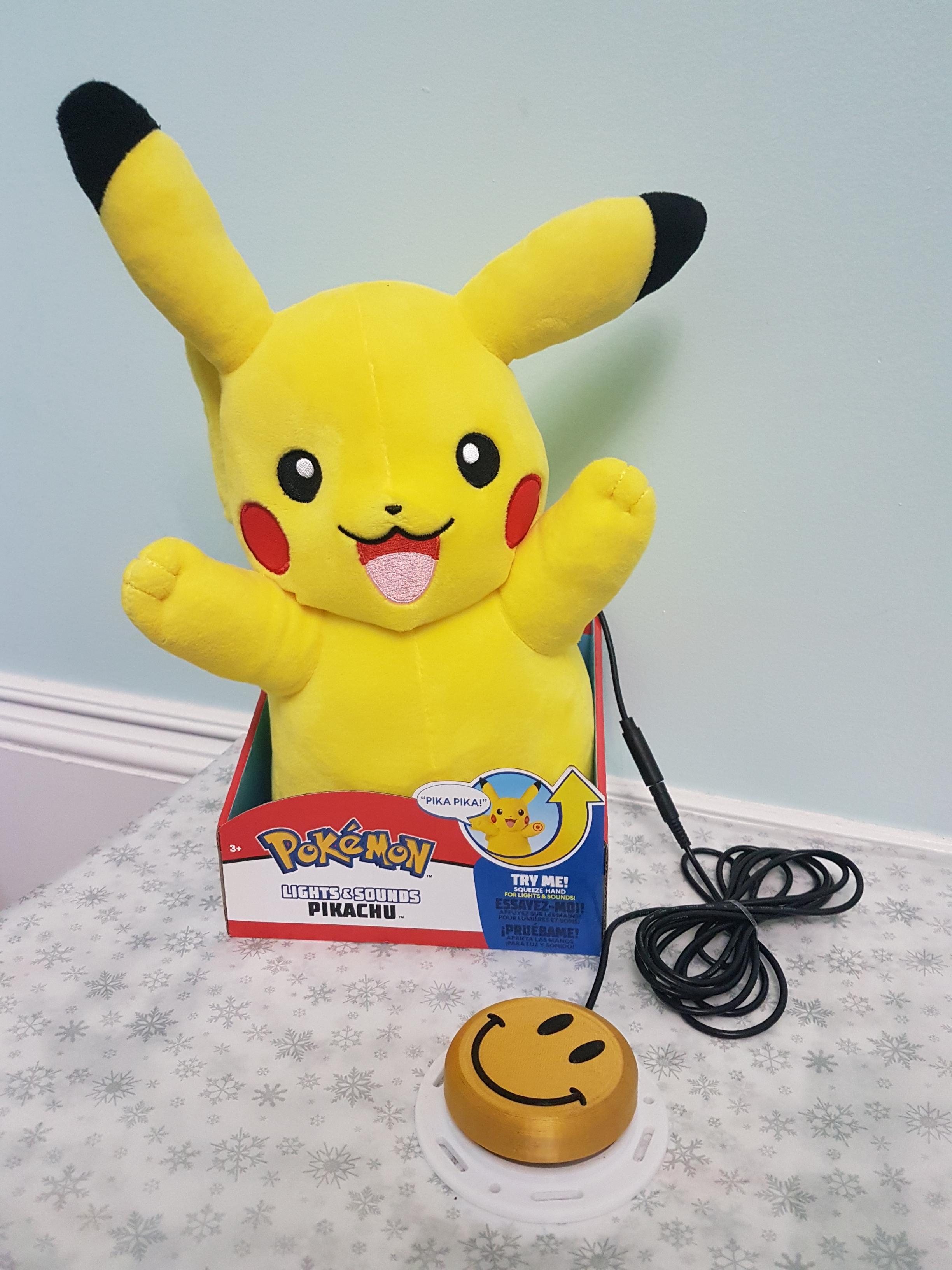 A switch adapted pikachu with a smiley face switch