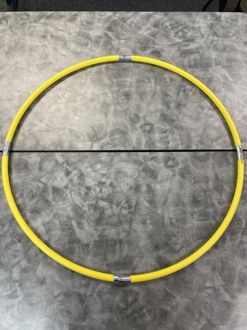 Putting aluminum tape on the hula hoop