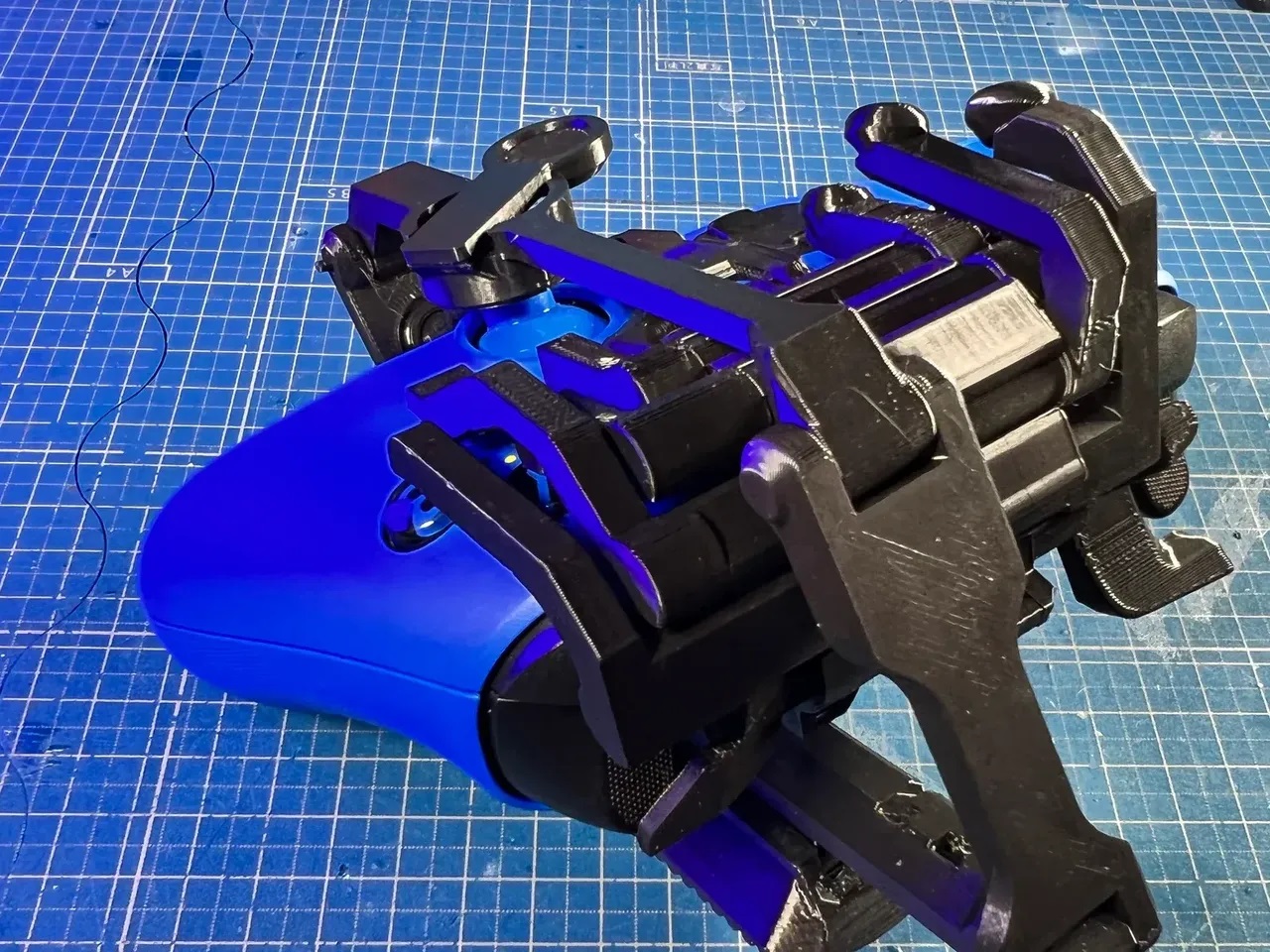 Back view of a one-handed controller modification on an Xbox Series X|S Controller. This controller modification is 3D printed in black and is the left-handed variation.