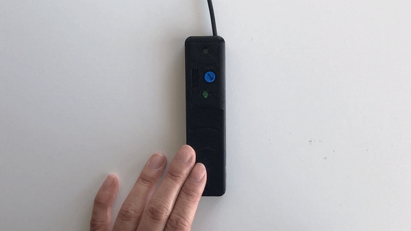 Animated gif showing the proximity switch being activated by a small lateral movement of a finger to cover the sensor
