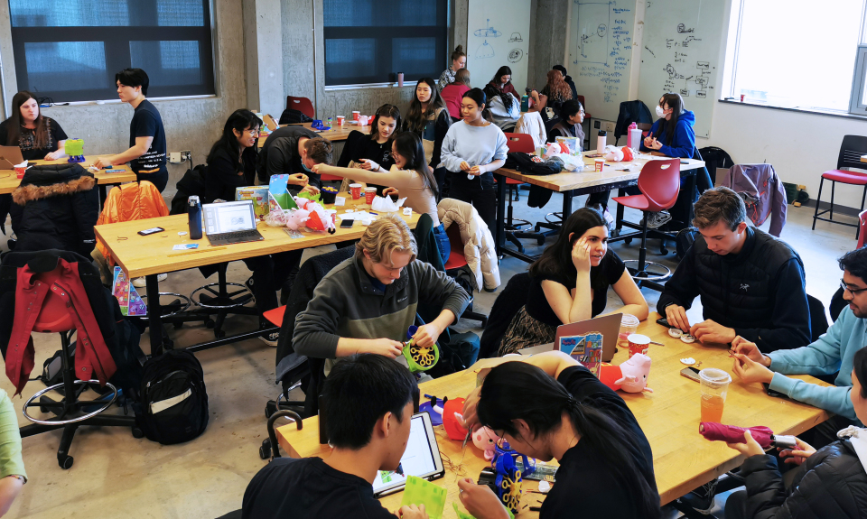 A group of volunteers at different completion stages of adapting devices.