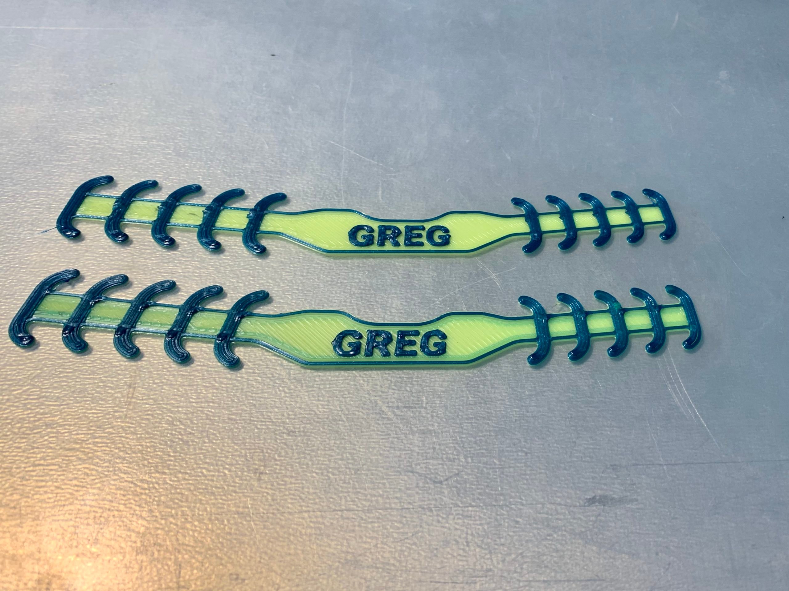 Picture of ear savers customized with the word Greg