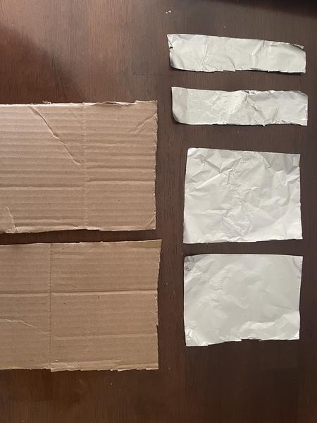 Cut lengths of aluminum foil and cardboard