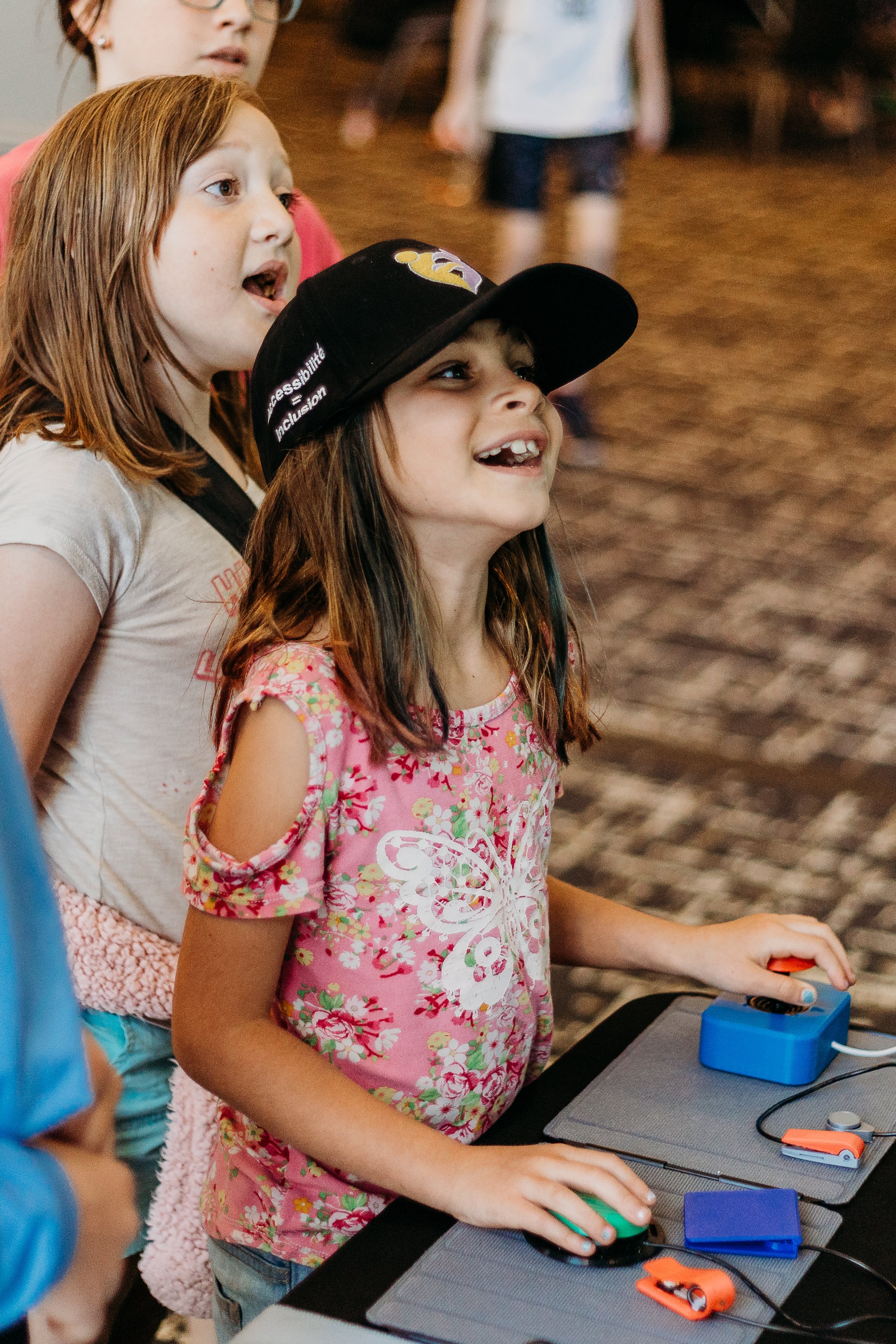 A child using an adaptive joystick to game.