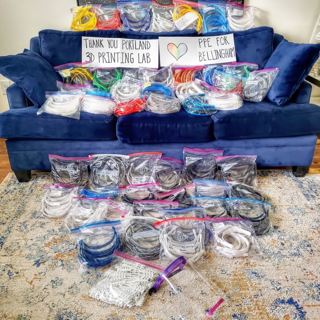 Assistive tech on a blue couch and on the floor.