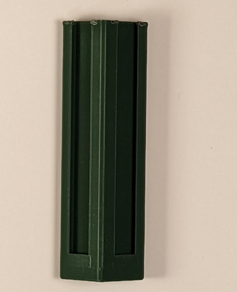 A green 3d printed one-handed joy con adapter against a white background.