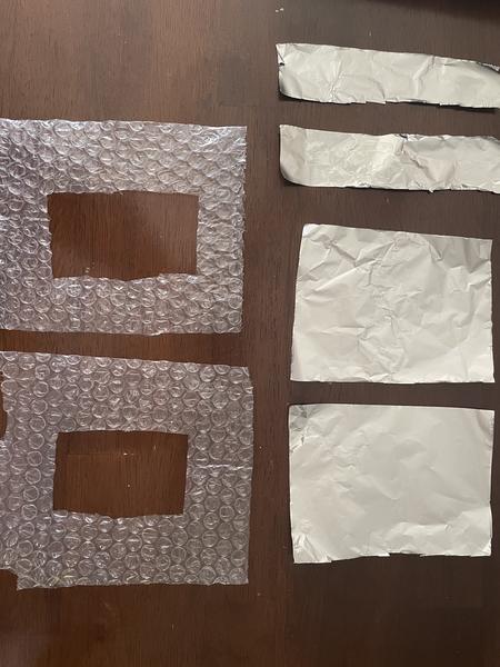 Cut shapes of aluminum foil and bubble wrap