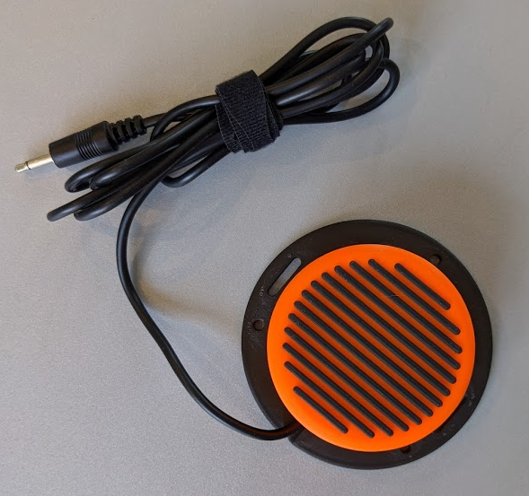 Interact switch, the top is orange with black lines.