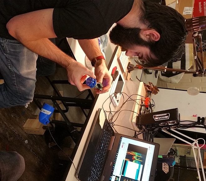 Luke working on a LipSync device.