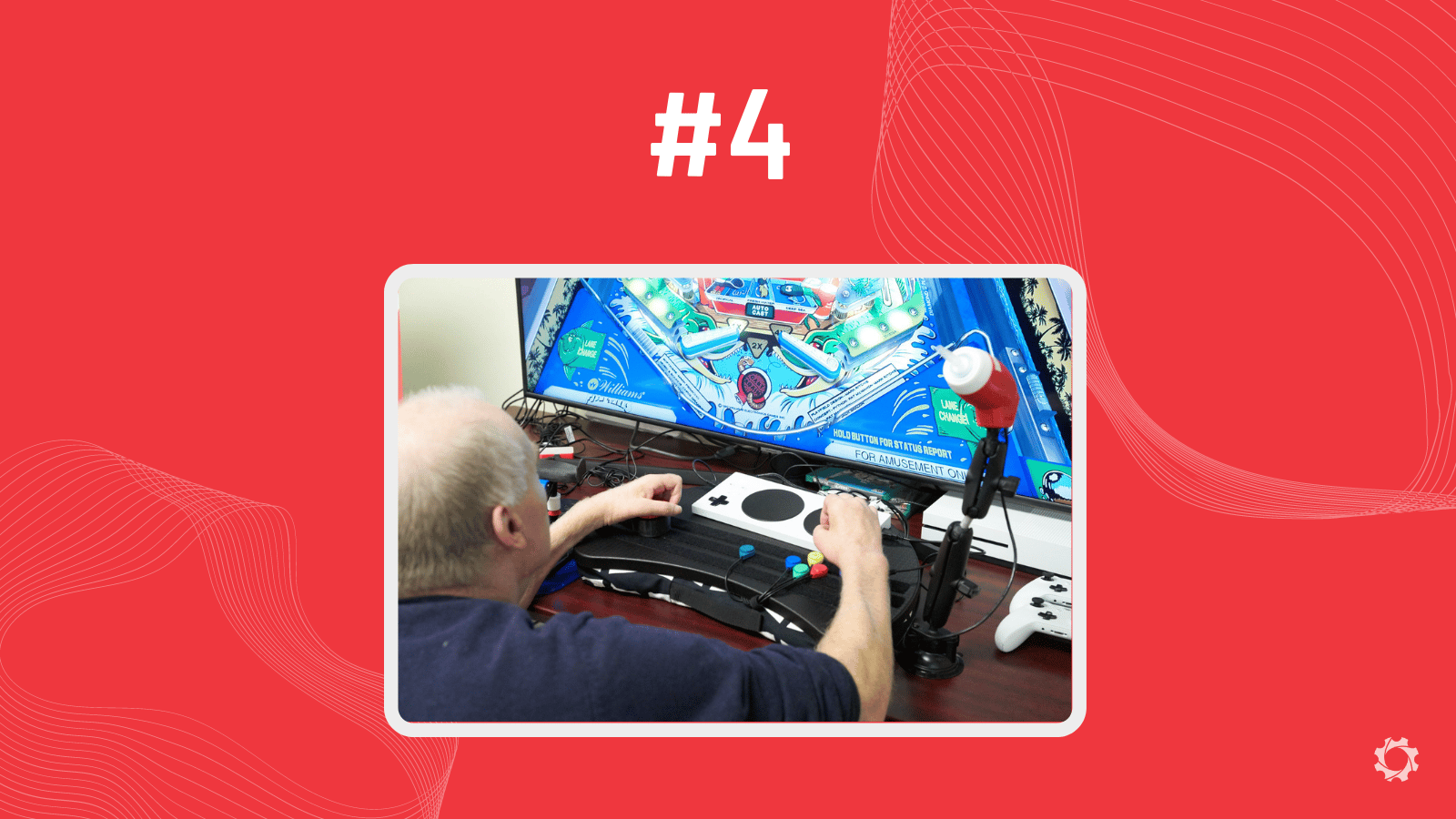 A red graphic with a person playing video games with adaptive equipment.