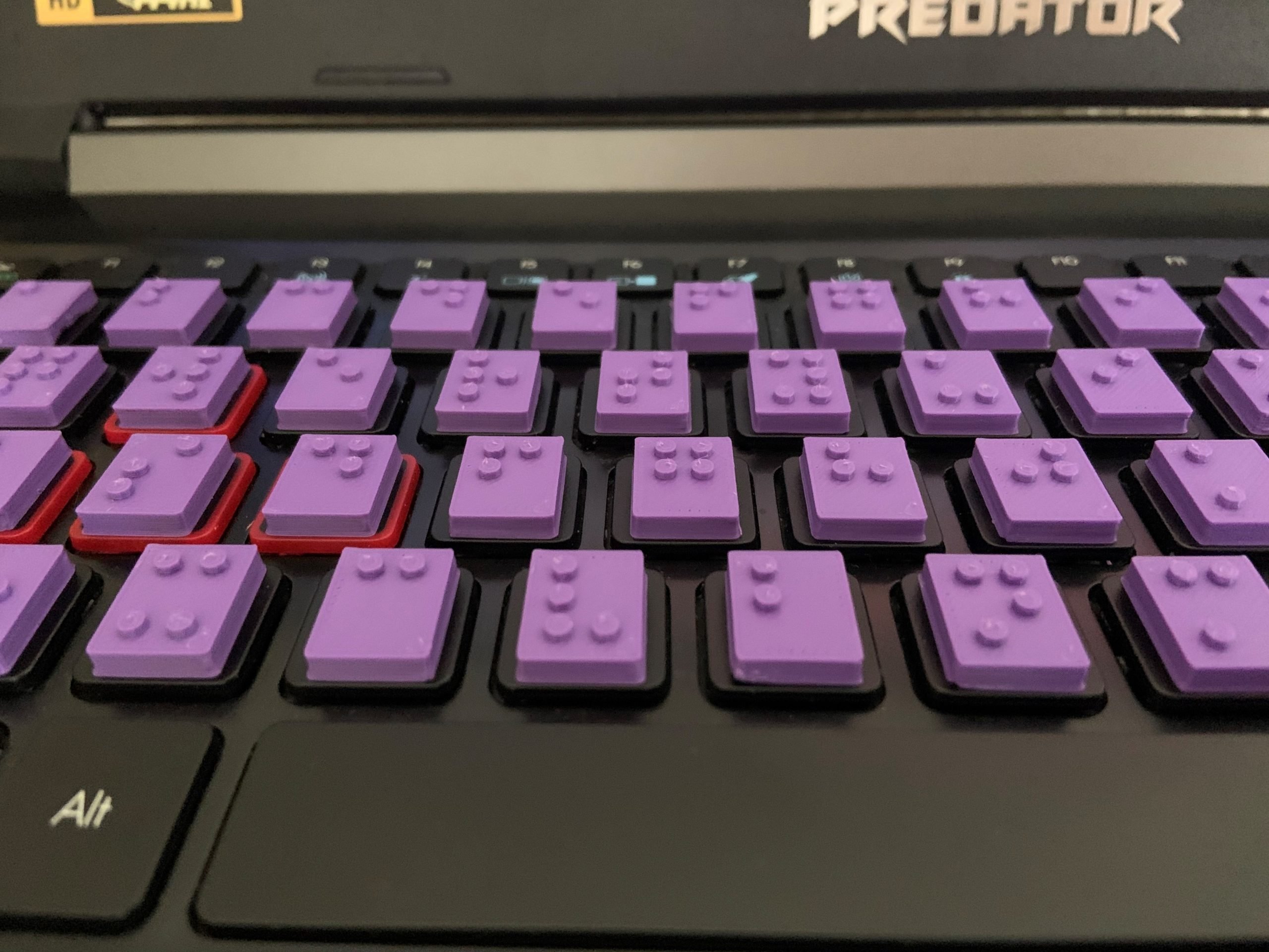 Image of 3d printed tiles with Braille attached to keyboard