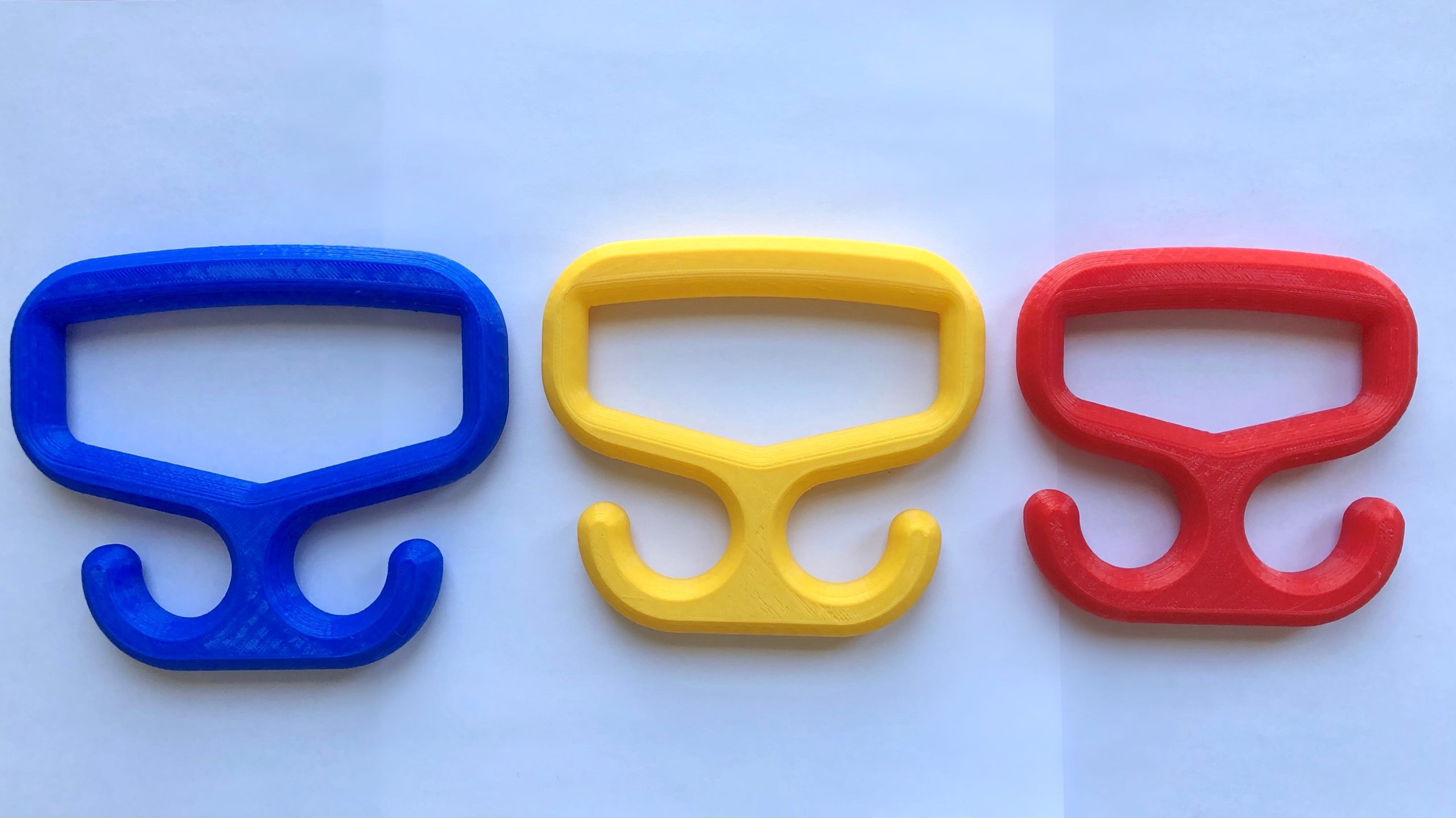 Three sizes of Bag Carrier in blue, Yellow and Red