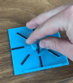A 3D printed tactile model with a hand rotating to one of 6 angles