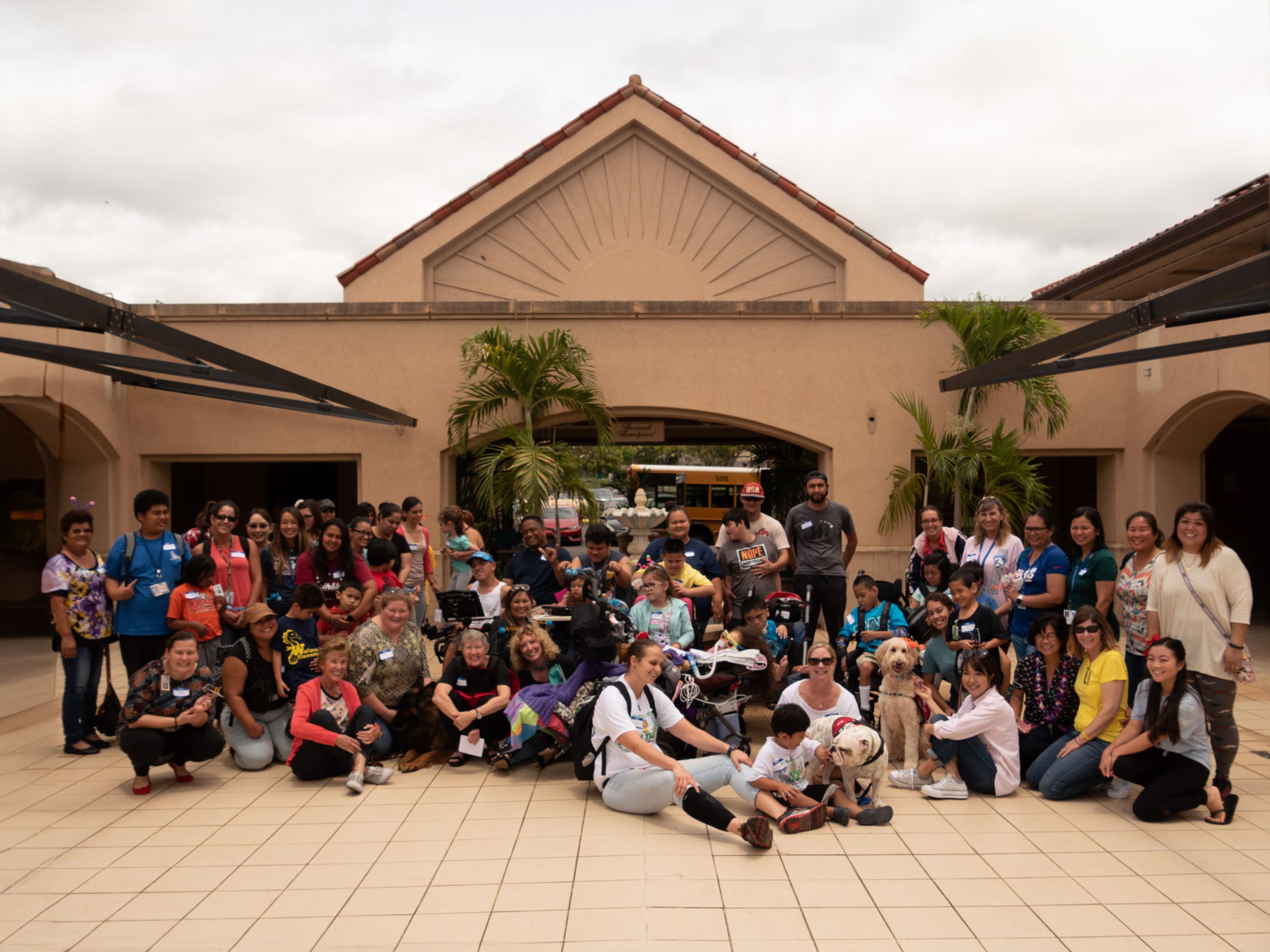 A large group shot of Center for Assistive Technology and Communication Hawaii (CATCH) staff and participants at an event.