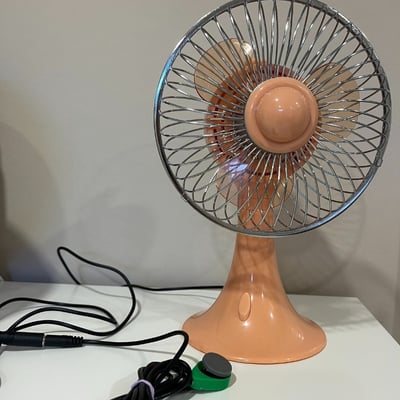 A raindrop switch plugged into a fan