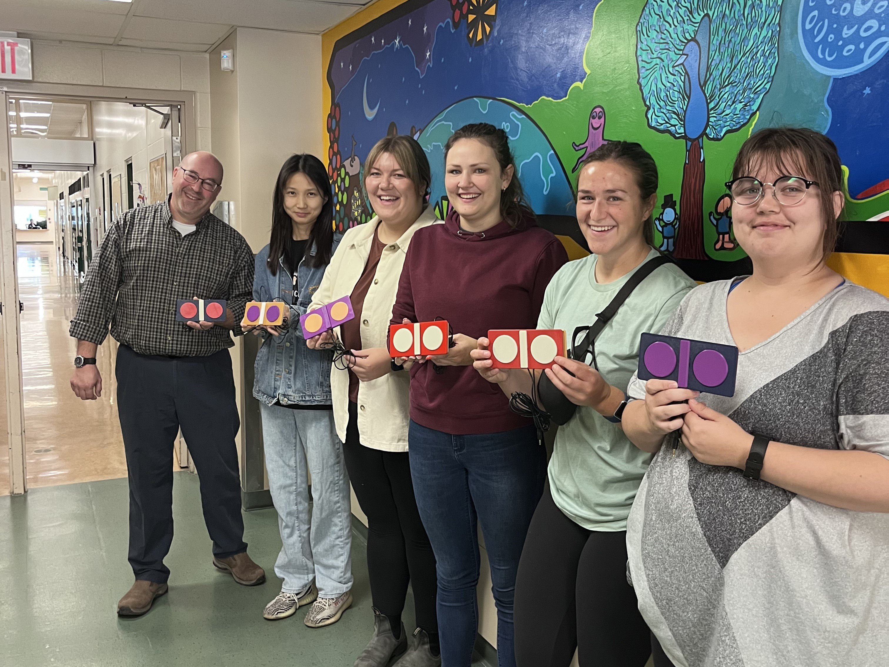 6 saskatoon student teachers holding their rocker switch