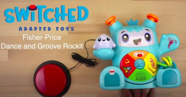 A switch adapted Fisher-Price Dance and Groove Rockit toy with an assistive switch.