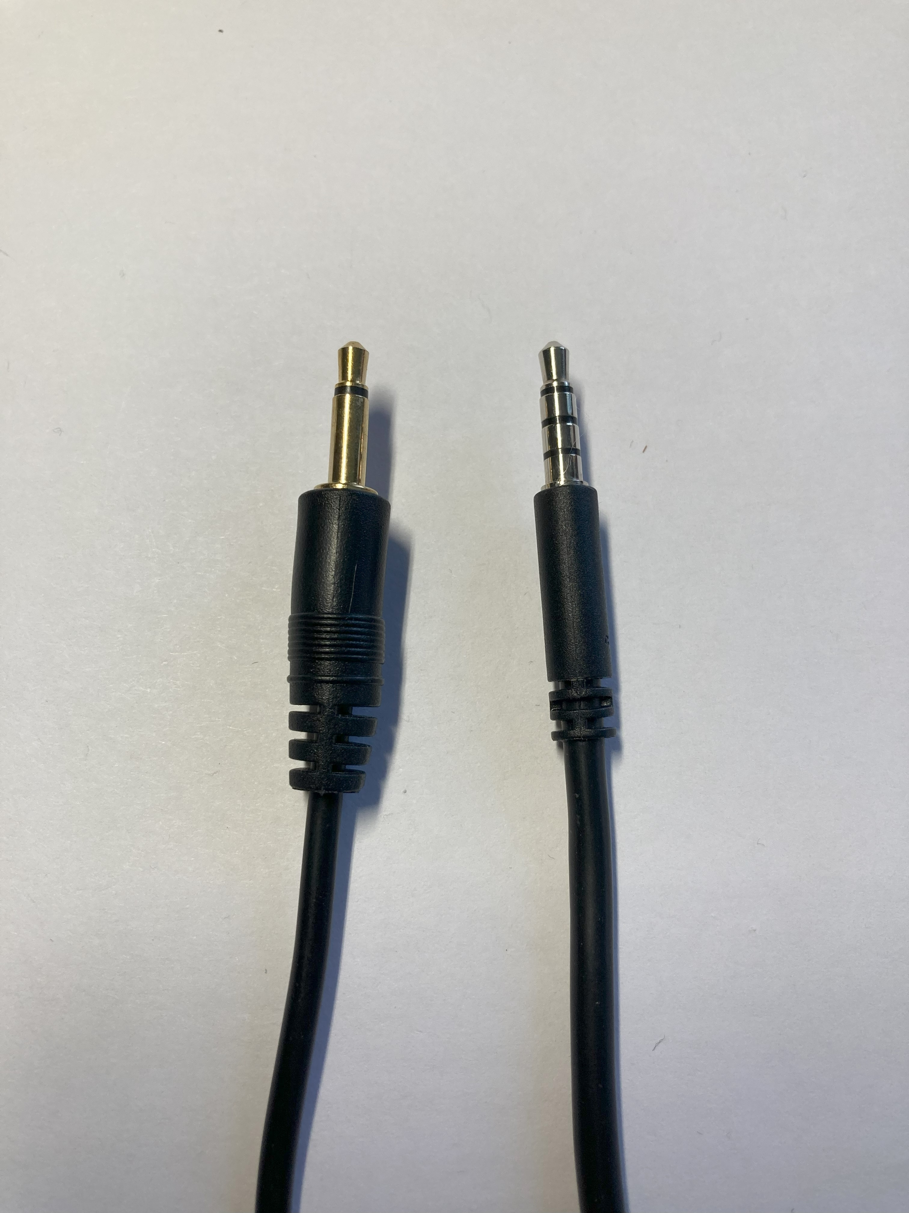 The two cables for the Spruce Mini Joystick showing a 2 conductor mono plug and a 4 conductor TRRS plug.