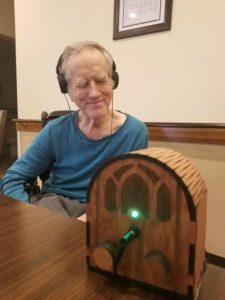 A user testing out the assistive music player device.