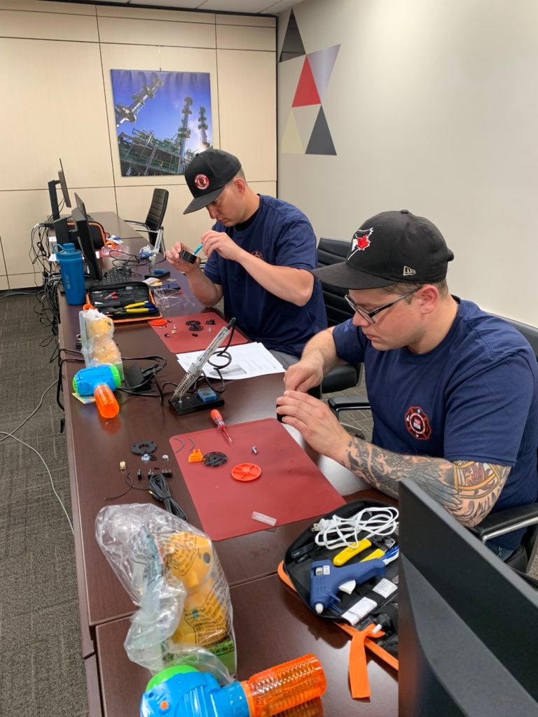 Participants soldering.