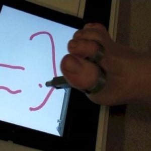 Toe stylus used to draw on a tablet.