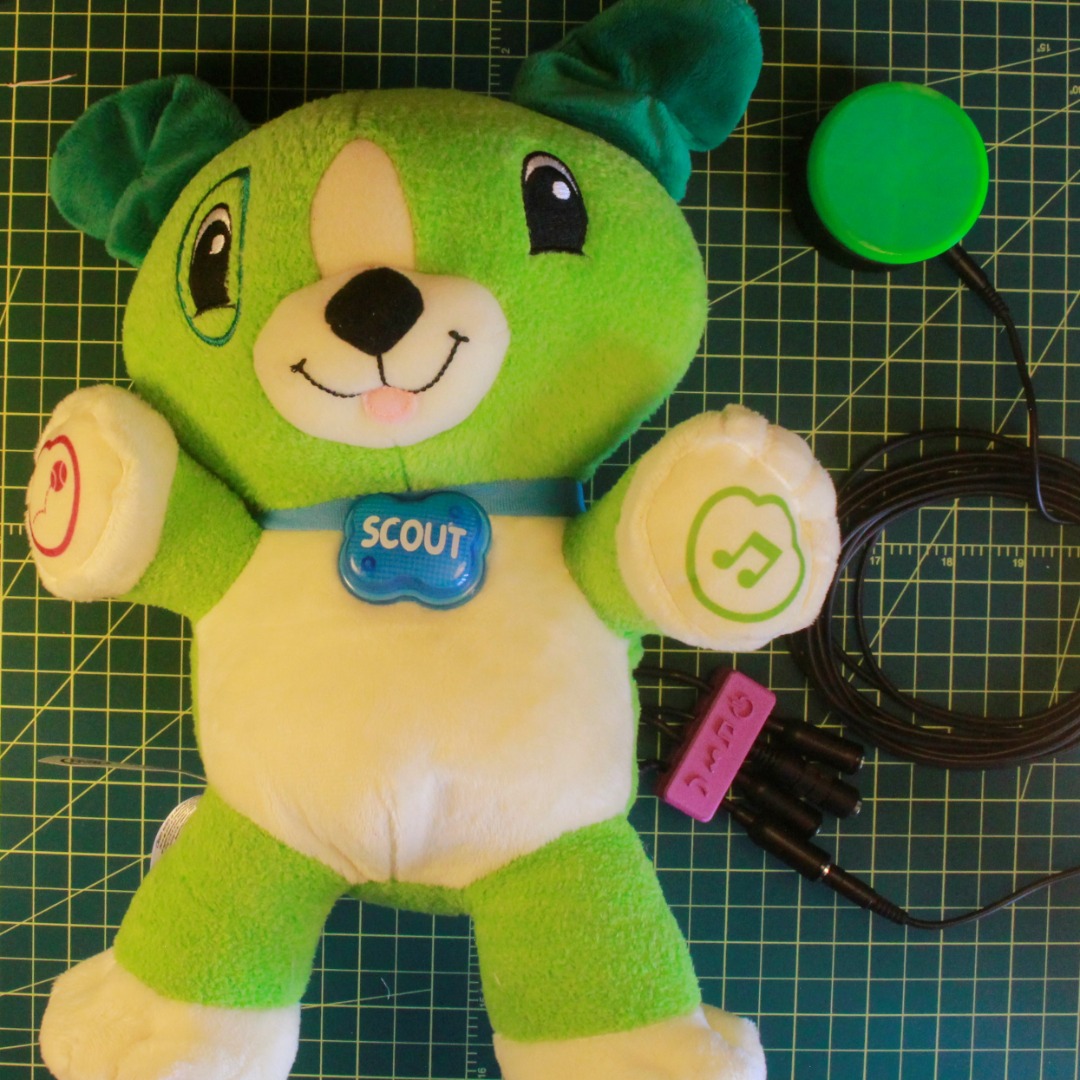 Scout toy on table with switch plugged in
