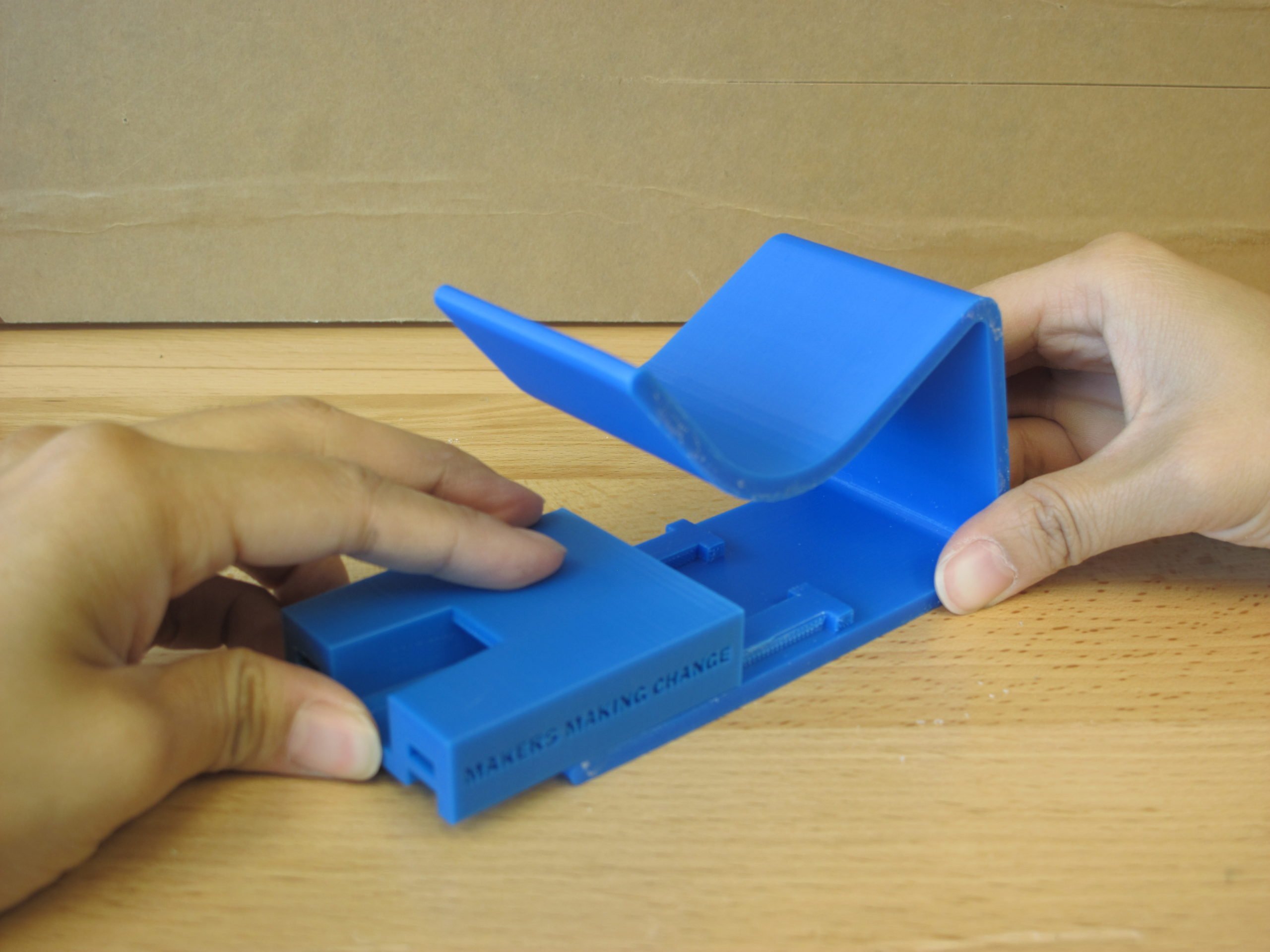 A user assembling the 3D Printed Nail Clipper to clip their nails with ease
