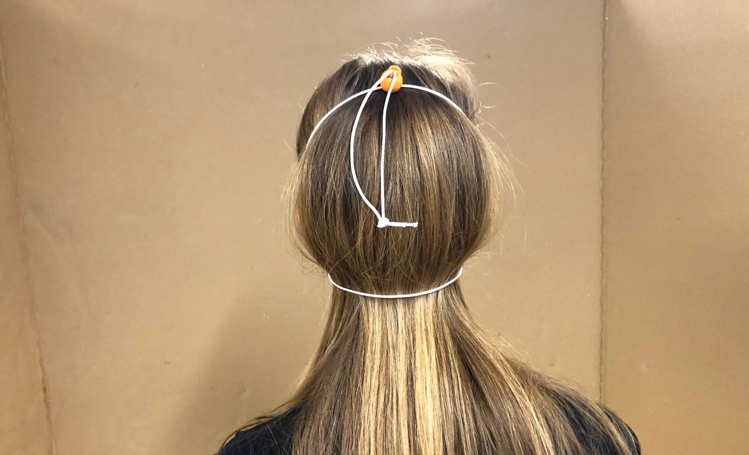 Back View of Person wearing Clearly Mask by TOM (Tikkun Olam Makers)