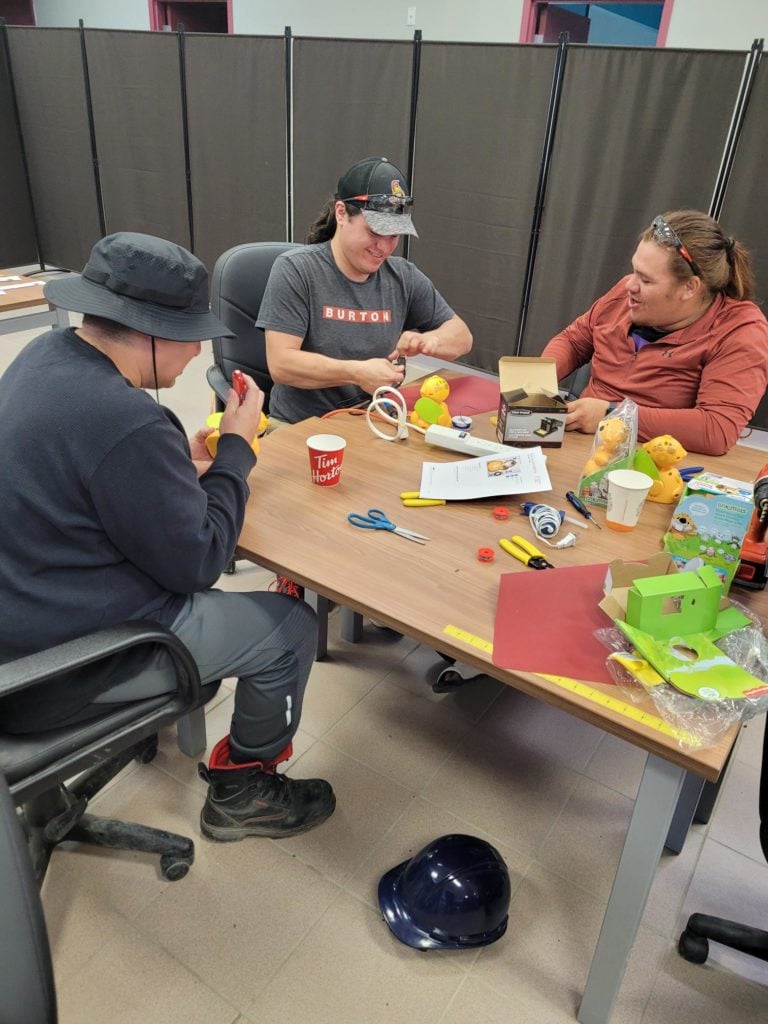 Three participants switch-adapted toys.