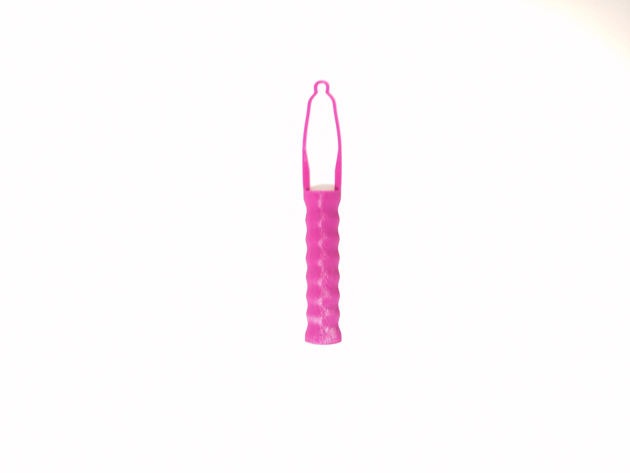 A pink 3d printed button aid assistive device against a white background.