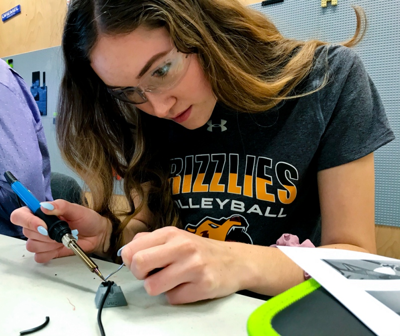 A volunteer soldering.