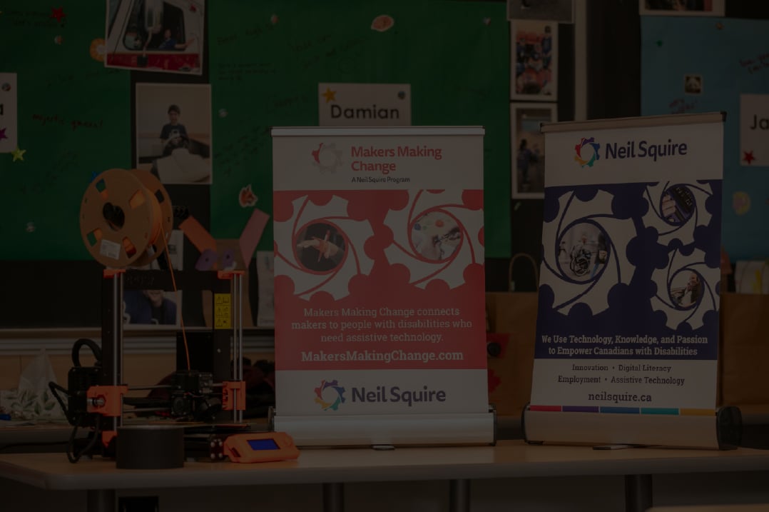 Two table top banners and a 3d printer on a table